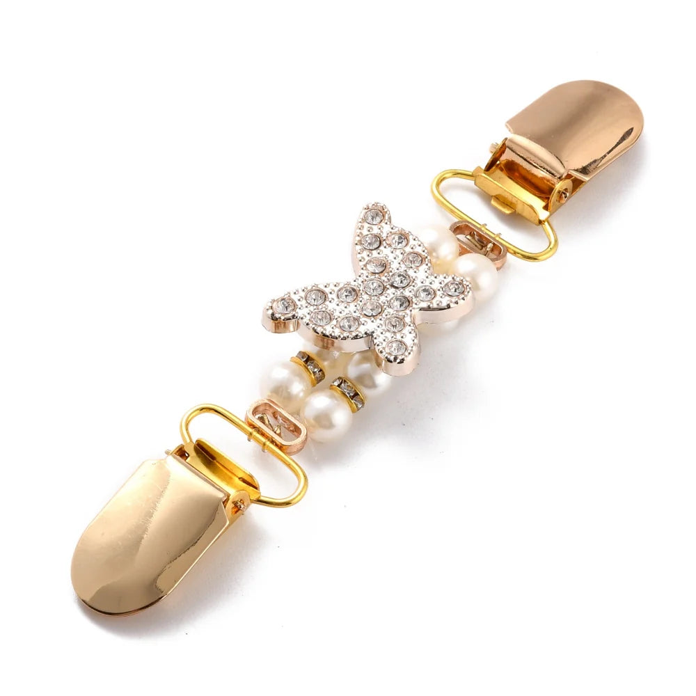 Fjärilsformat koftspänne i guldplätering med vacker rhinestone